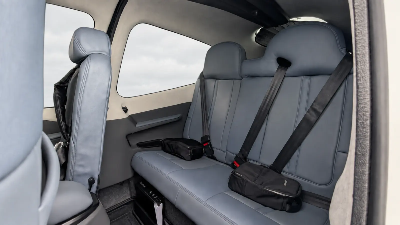 N721TP rear seats and cabin with a soft cloudy-sky background