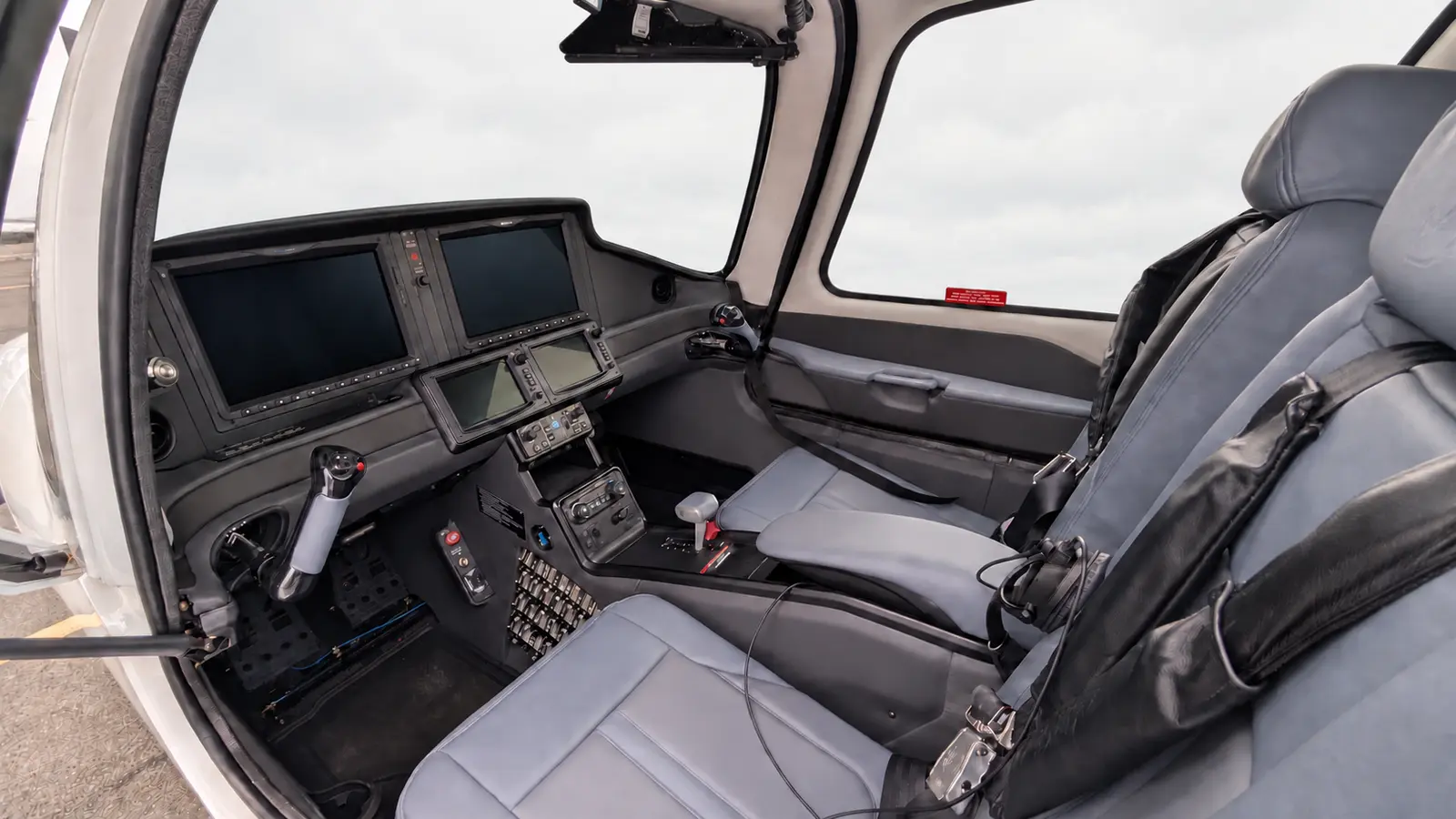 N721TP Perspective Touch+ cockpit with a soft cloudy-sky background